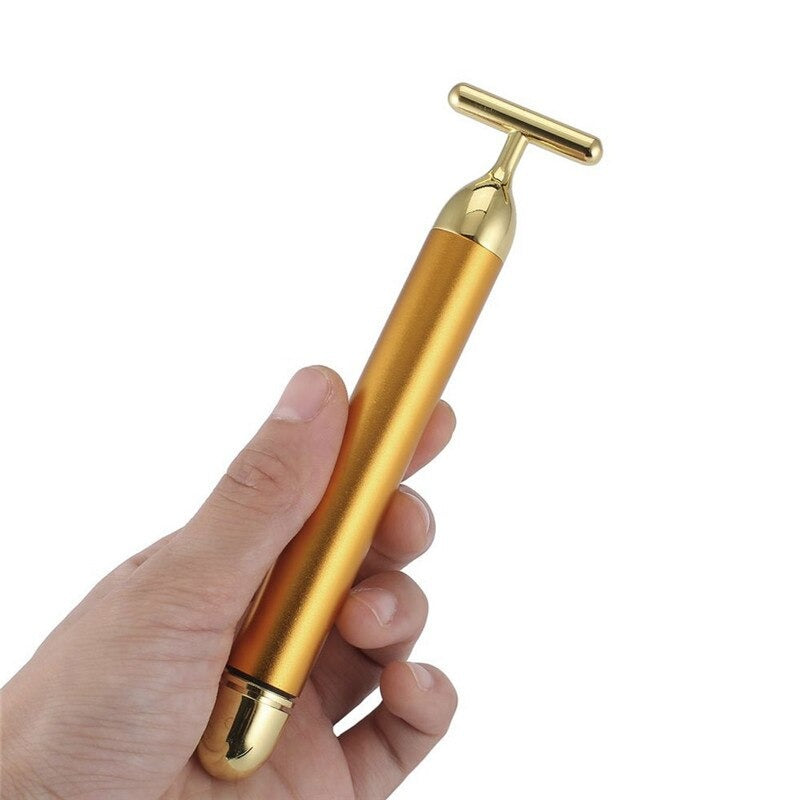 Exklusiver 24K Gold Vibrations-Gesichtsroller für eine revitalisierende Gesichtspflege und Lifting-Wirkung.