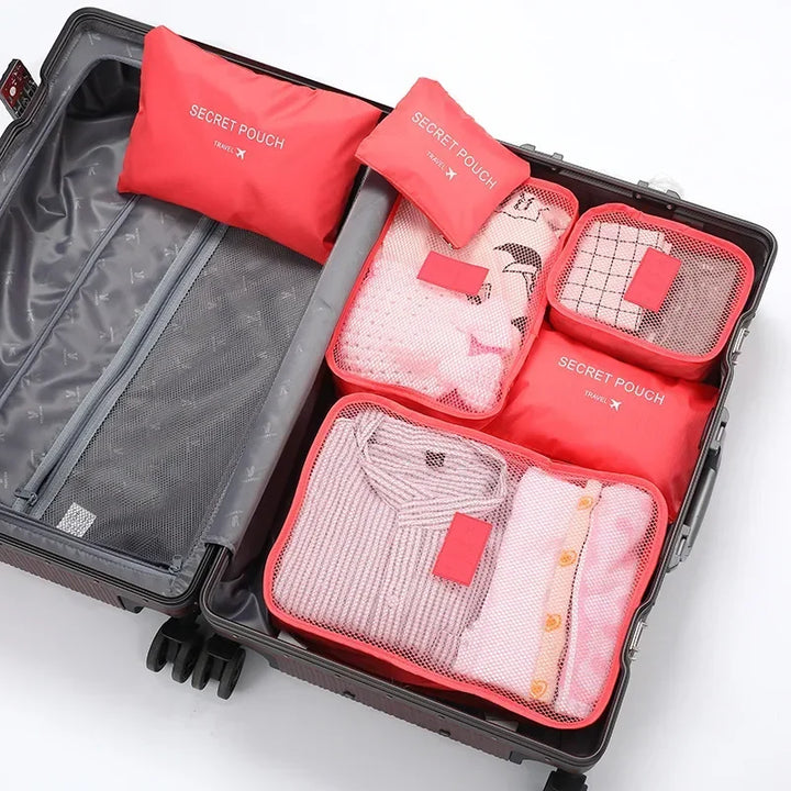 Kompakt gefaltetes 6-teiliges Kofferorganizer Set, ideal für platzsparende Aufbewahrung zu Hause.