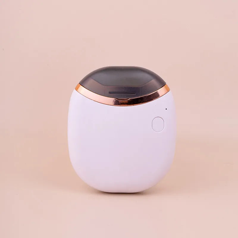 Eleganter, kompakter automatischer Nagelknipser; moderne elektrische Nagelpflege für Zuhause.