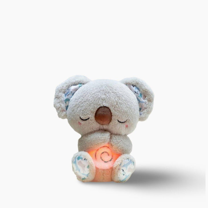 Beruhigender Koala Plüsch, graues Fell, sitzend, mit entspannenden Funktionen, ideal als Schlafhilfe.