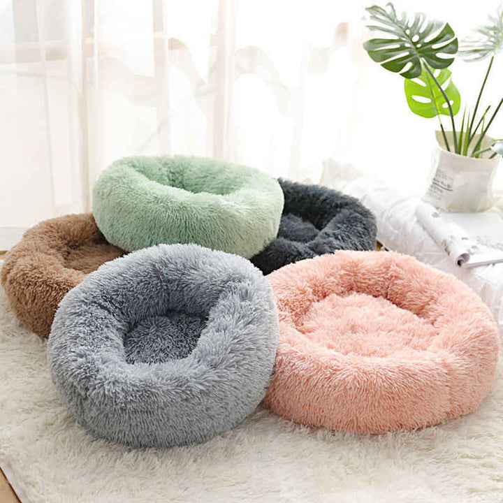 Ergonomisches Donut Haustierbett, stützt Kopf & Nacken für optimalen Komfort.