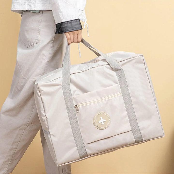 Unisex Wochenendtasche aus robustem Polyester, faltbar und trolley-kompatibel. Perfekt als Handtasche oder Aufbewahrungstasche.