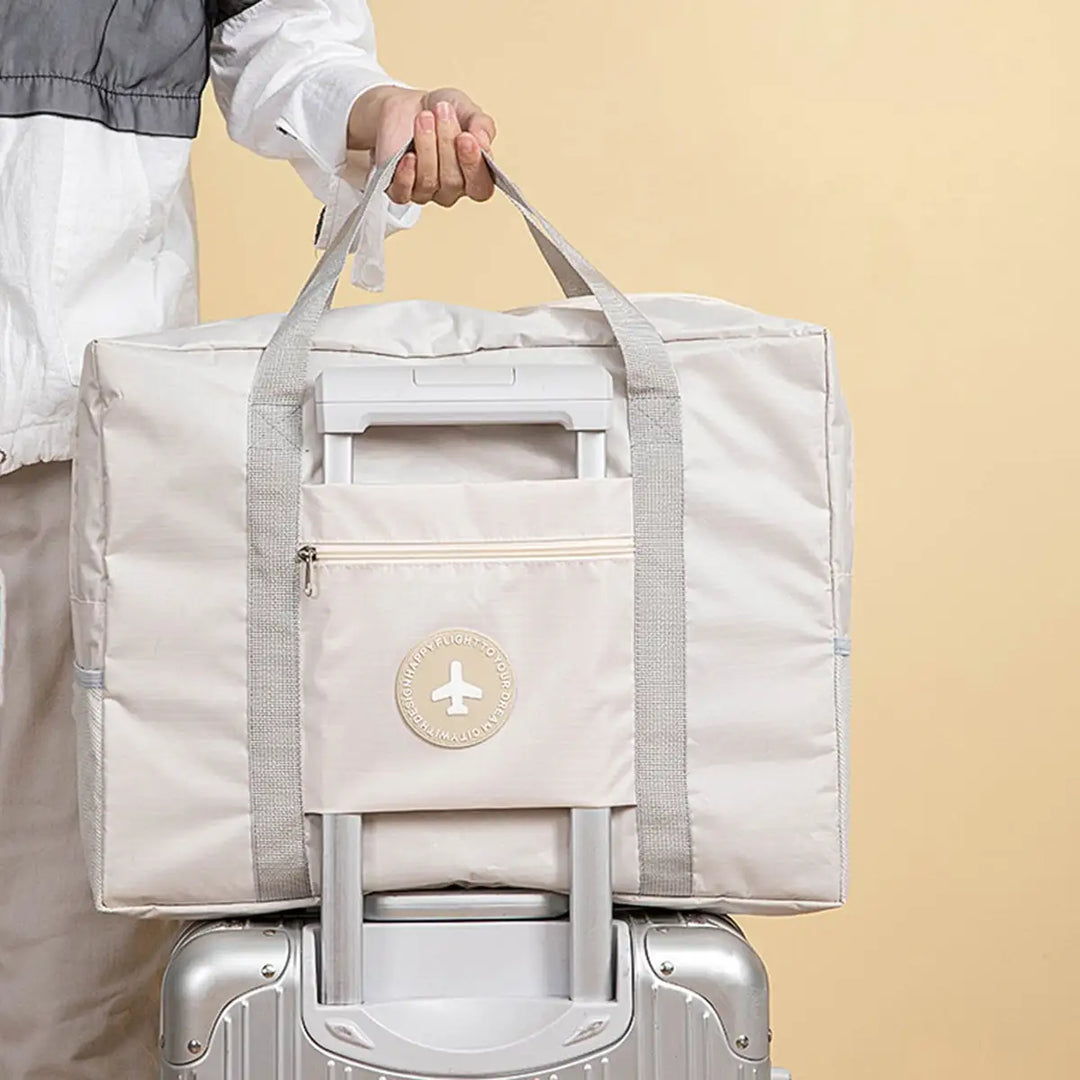 Faltbare Unisex Handtasche/Wochenendtasche aus strapazierfähigem Polyester, blau & beige. Ideal als Trolley-kompatible Reisetasche.