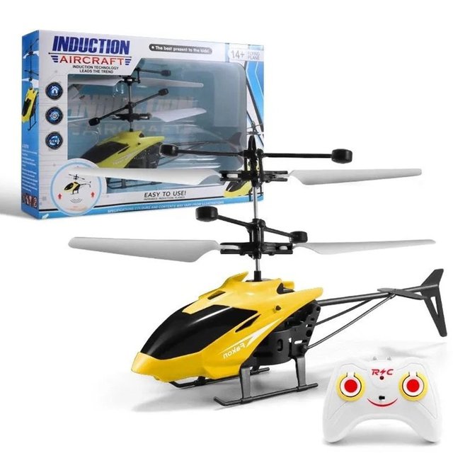 Kinder RC-Helikopter landet auf grünem Rasen. Robustes ferngesteuertes Spielzeug für Anfänger und Outdoor-Flugspaß.
