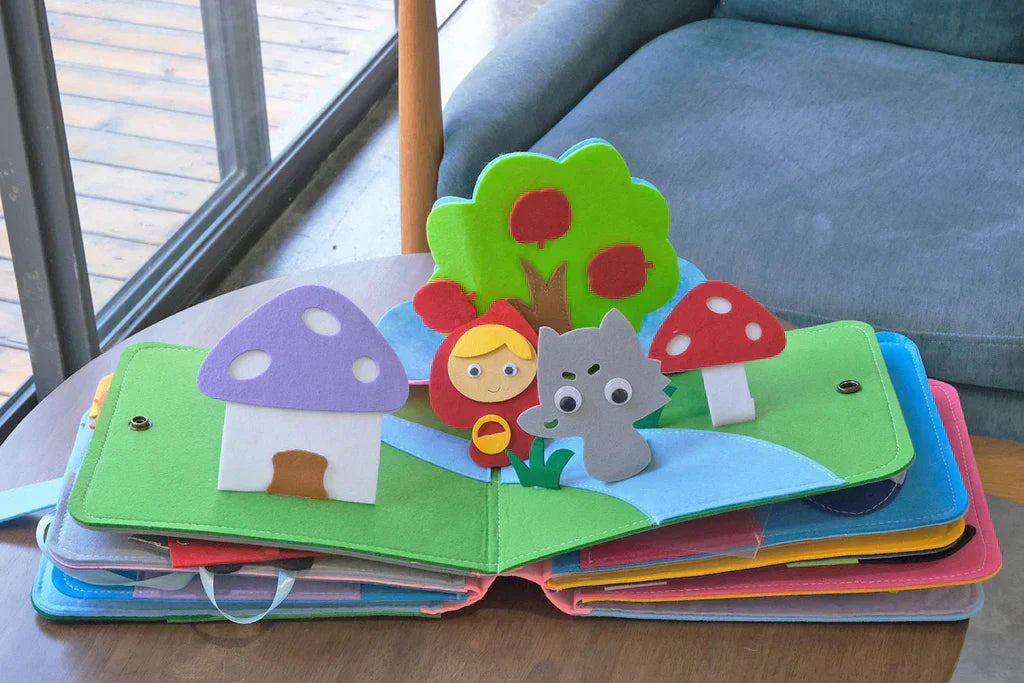 Hochwertiges Montessori Filzbuch. Buntes Lernspielzeug, das spielend Kreativität, Feinmotorik und kognitive Fähigkeiten anregt.