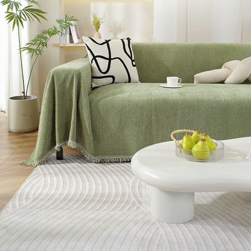 Stilvoller Heimtextil-Überwurf aus Chenille, Fischgrät-Design und Quasten für Gemütlichkeit.