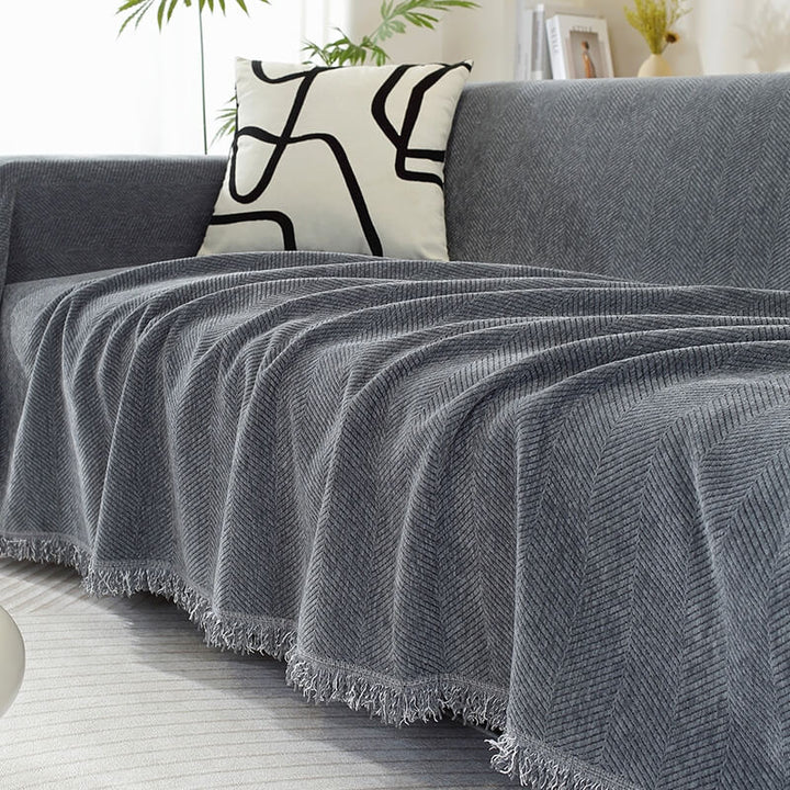 Gemütlicher Chenille Sofabezug mit Fischgrätenmuster und Quasten für Schutz & Dekoration.