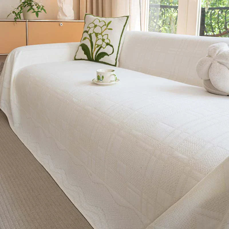 Gemütliche Chenille Schutzhusse mit modernem Karomuster. Verleiht Ihrem Sofa frischen Look & bietet Schutz.
