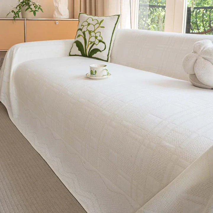 Gemütliche Chenille Schutzhusse mit modernem Karomuster. Verleiht Ihrem Sofa frischen Look & bietet Schutz.