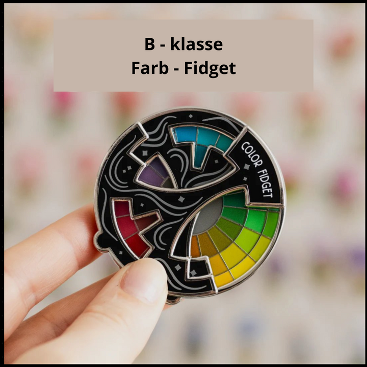 Vielseitiger ChromoSpin Farb-Pin: Emaille Farbkreis, nutzbar als Anstecker, Schlüsselanhänger oder Magnet.