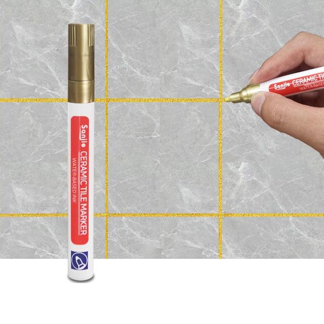 Ergonomischer Fugenstift zum schnellen Überstreichen von Fliesenfugen in der Küche.