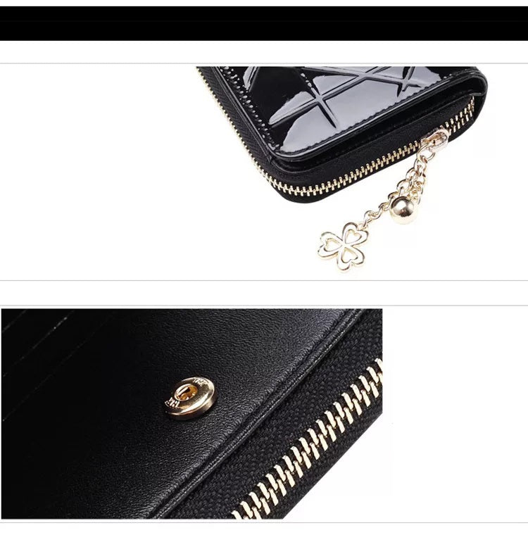 Elegante Damen Geldbörse mit goldfarbenem Reißverschluss. Schwarzes, kompaktes Portemonnaie. Stilvolles Accessoire.