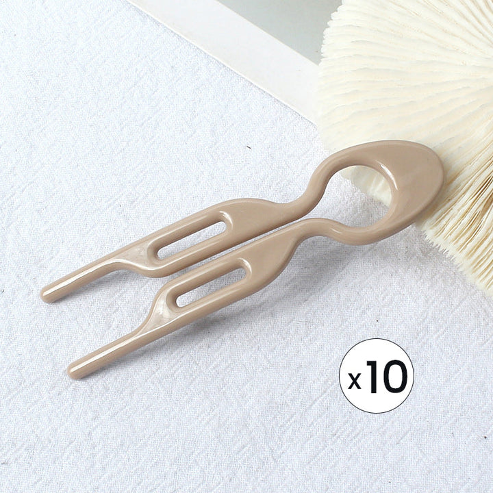 Damen GlamGrip Haarspange als Akzent in einer romantischen Hochsteckfrisur, für besondere Eleganz.