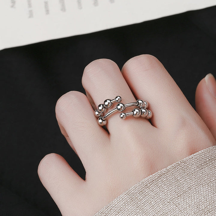 Eleganter Perlenring für Damen & Herren, als Schmuckstück und Fidget Ring zur Stressreduktion im Alltag.