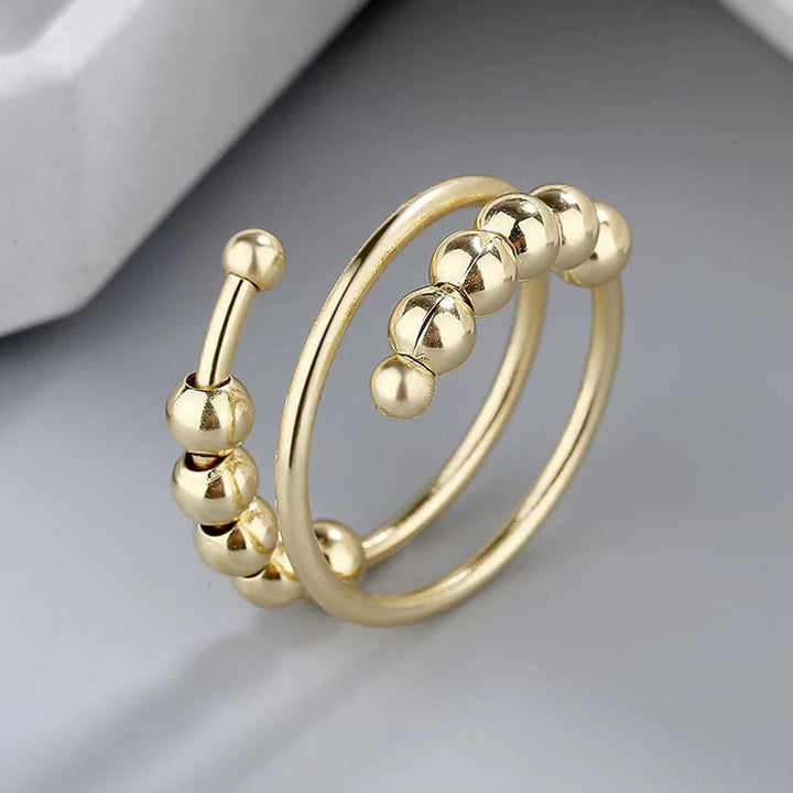 Hochwertiger Anti-Angst Ring mit sanft gleitenden Perlen, ein stilvolles Schmuckstück für Damen & Herren.