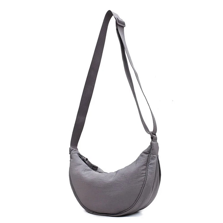 Leichte Umhängetasche in Knödelform, perfekte Stofftasche für Damen.