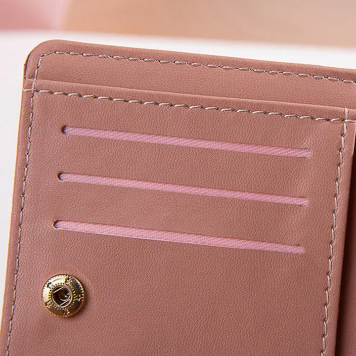Handliche Damen Geldbörse mit Quaste, perfekt für die kleine Tasche, elegant & leicht zu tragen.