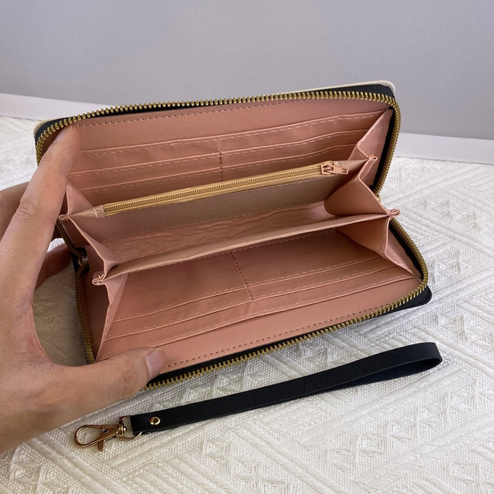 Elegante geometrische Damen Geldbörse mit stilvoller Quaste. Langes Portemonnaie als modisches Accessoire.