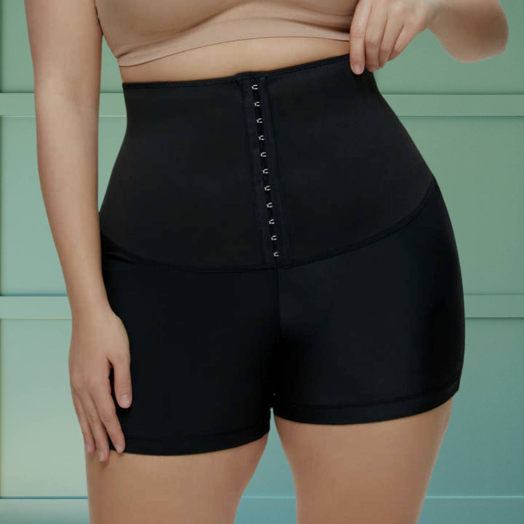 Frau trägt Damen Sauna-Schweißhose mit Taillentrainer, bereit für Fitness, Training & Abnehmen.