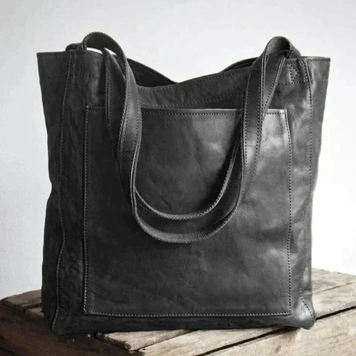 Schwarze Damen Umhängetasche aus Kunstleder, ein modernes und langlebiges Accessoire für Damen.