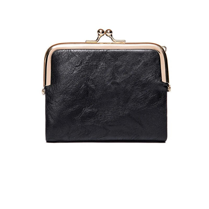 Stilvolle Vintage Damen Brieftasche mit sicherem Kussverschluss, kompaktes Mode-Accessoire.