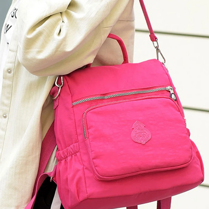 Leichter Multifunktionsrucksack für Damen, wasserdicht, als Umhängetasche oder Handtasche nutzbar.