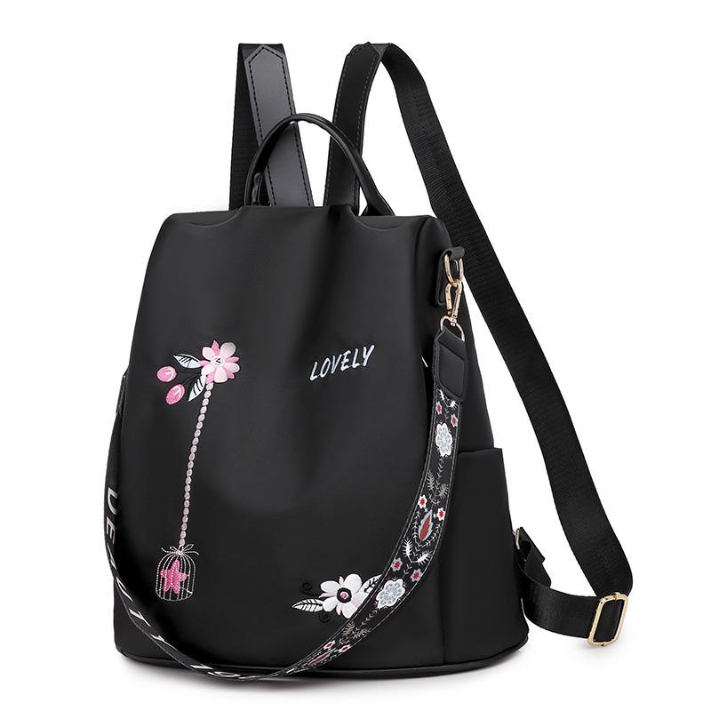 Damenrucksack wasserdicht, schwarz mit stilvoller Blumenstickerei; ideal für Alltag & Reise.