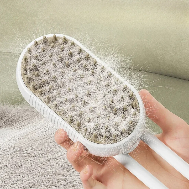 Ergonomische Dampfbürste zur Fellpflege bei Haustieren. Entfernt lose Haare und massiert sanft.