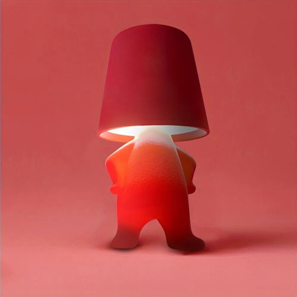 Wiederaufladbare HUMISHAPE LED-Tischlampe. Eine moderne Designlampe in Menschenform für stilvolles Licht.