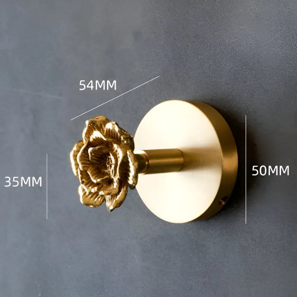 Dekorativer Gold-Blumen-Wandhaken, aufwendiges Design, stilvoll & praktisch für Küche oder Bad.