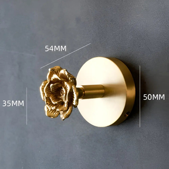Dekorativer Gold-Blumen-Wandhaken, aufwendiges Design, stilvoll & praktisch für Küche oder Bad.