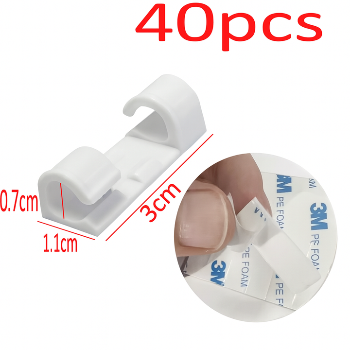 Arrangement von 40 selbstklebenden Kabelclips für universelles Kabelmanagement zuhause oder im Büro.