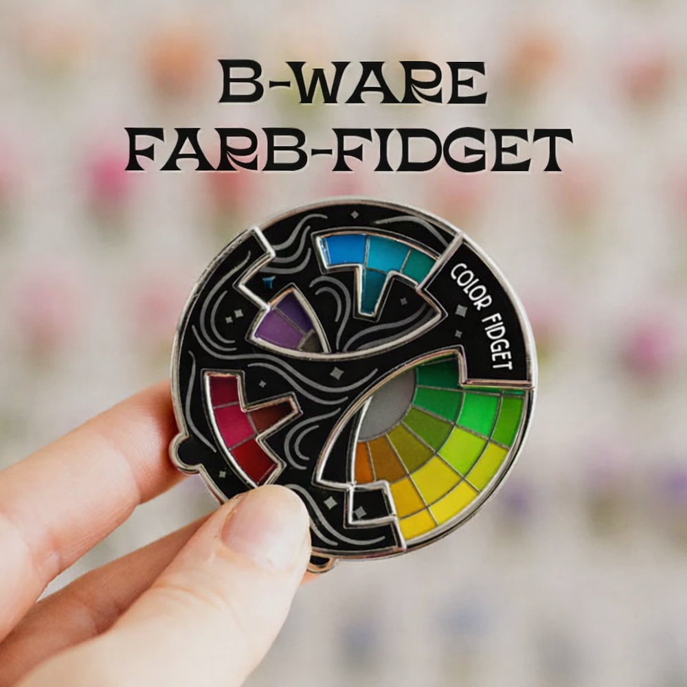 Hochwertiger drehbarer Emaille-Anstecker mit komplexem Farbenlehre-Design. Ideal als Fidget Pin & Sammlerstück.