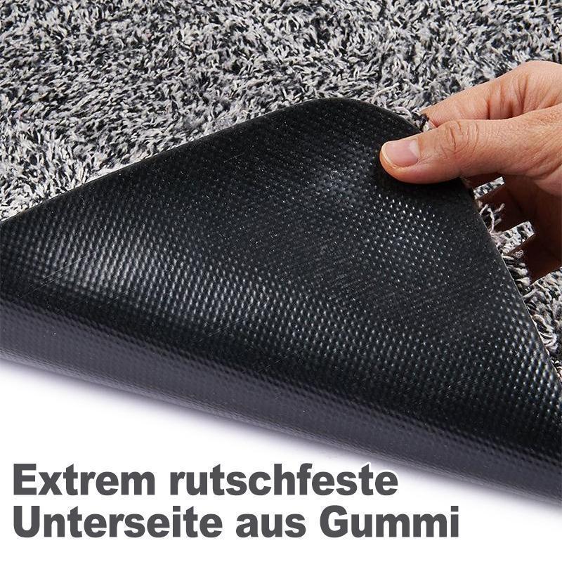 Dunkelgraue Schmutzfangmatte, magisch saugfähig, eine hygienische Lösung für jeden Haushalt.