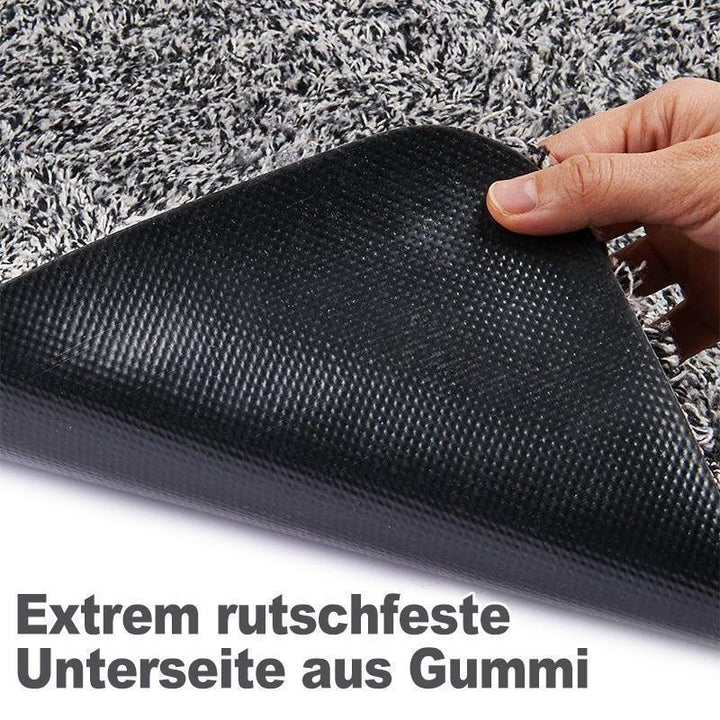 Dunkelgraue Schmutzfangmatte, magisch saugfähig, eine hygienische Lösung für jeden Haushalt.