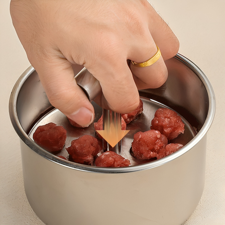 Handlicher Küchenhelfer aus Edelstahl zum schnellen Formen von Fleischbällchen. Für präzise, gleichmäßige Ergebnisse.