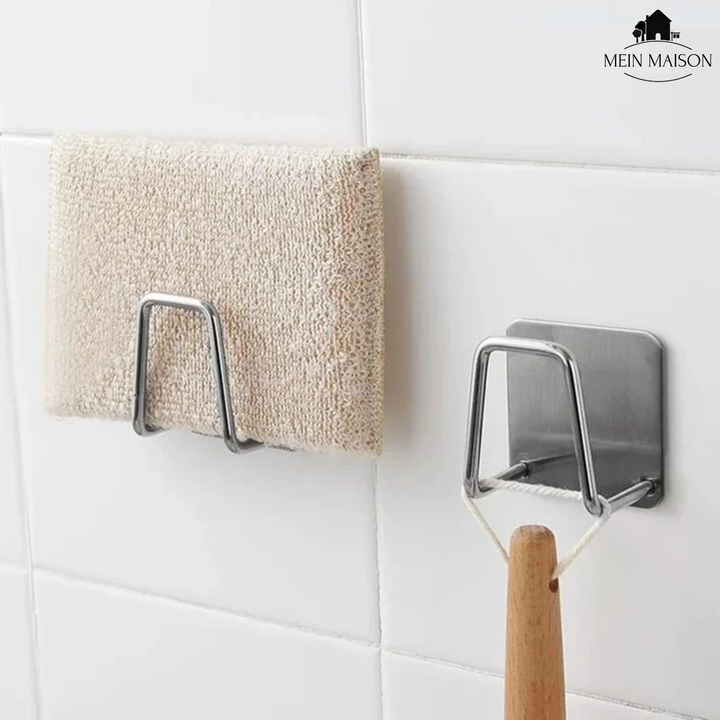 Eleganter Schwammhalter aus Edelstahl für die Küche, sorgt für ordentliche und trockene Schwämme am Spülbecken.