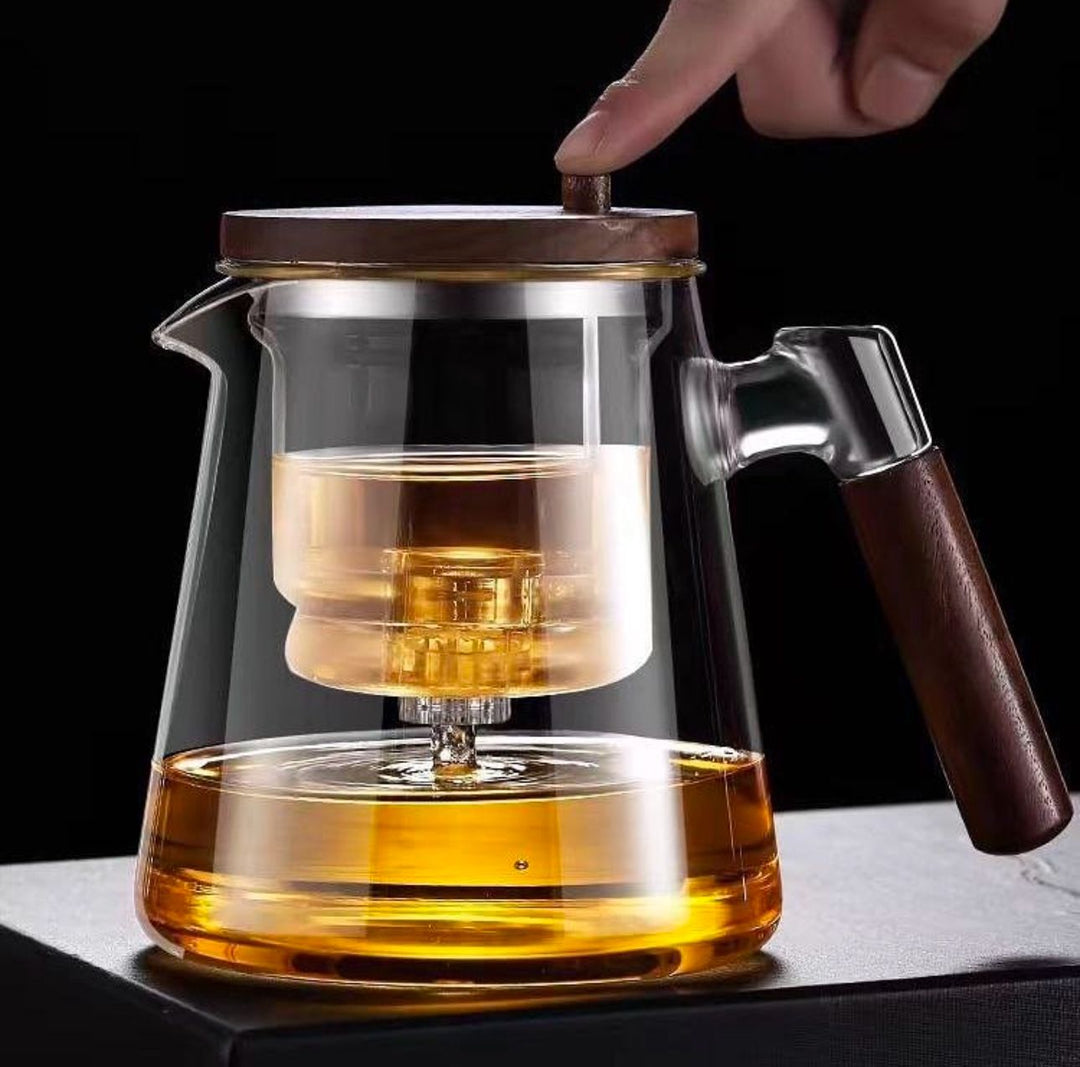 Edle Glas-Teekanne (1 Liter) mit hitzebeständigem Borosilikatglas und elegantem Holzgriff für stilvollen Teegenuss.