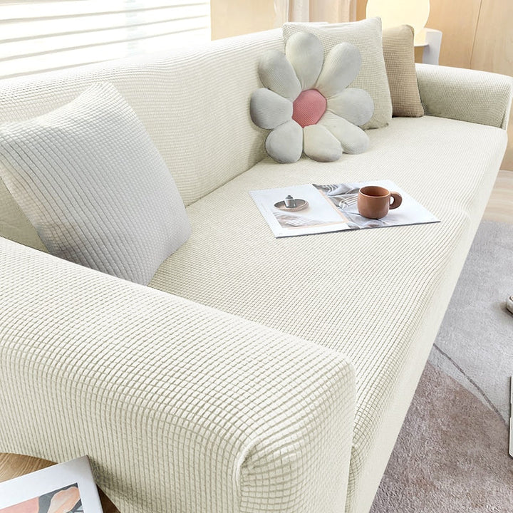 Dekorative Sofahusse mit Stretchfunktion, für ein gemütliches und geschütztes Wohnambiente.
