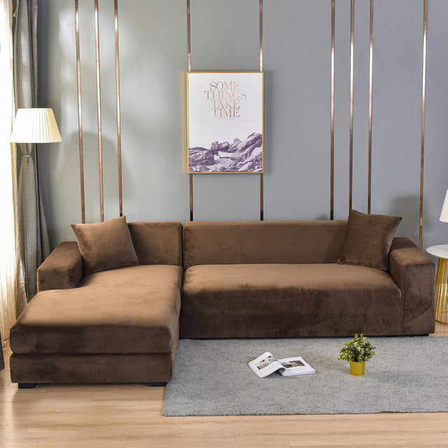 Grauer Universal Sofabezug, dehnbar. Verwandelt Ihr altes Sofa in ein modernes Möbelstück.