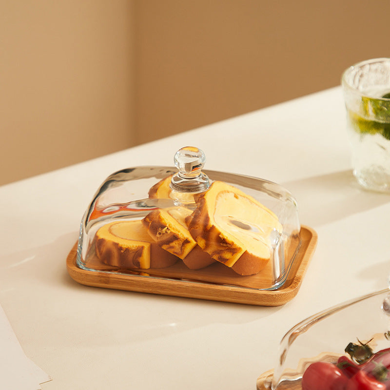 Hochwertige Akazienholz-Butterdose mit klarem Glasdeckel für frische Butter.