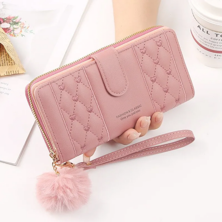 Damenaccessoire: Herz-bestickte Geldbörse mit Handschlaufe, ideal für Organisation.