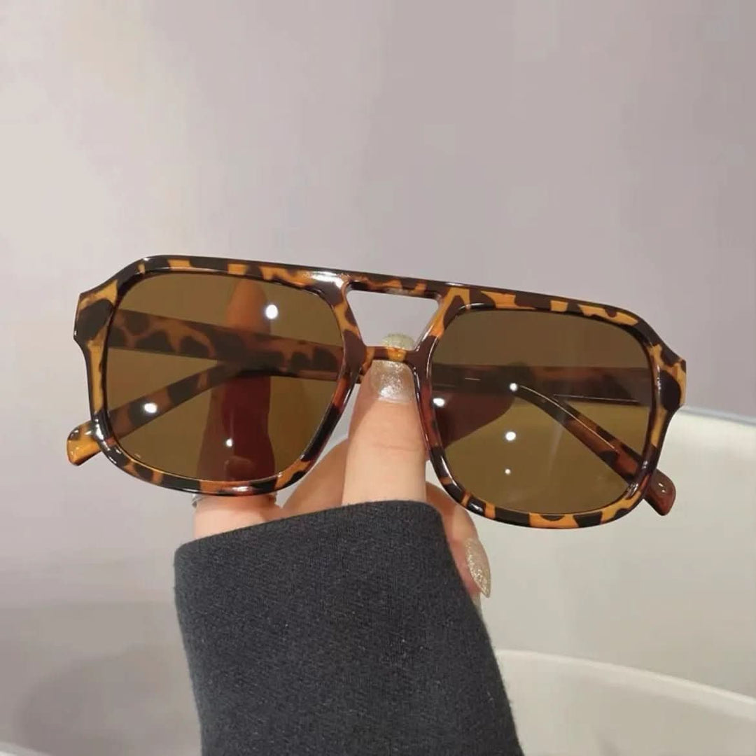 Vintage-inspirierte Katzenaugen-Sonnenbrille für Damen, elegant, UV400-Schutz, stilvoller Retro-Look.