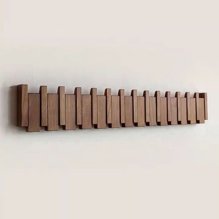 Elegante Wandgarderobe im Klavierstil aus handgefertigtem Holz mit platzsparenden Klapphaken für Flur & Diele.