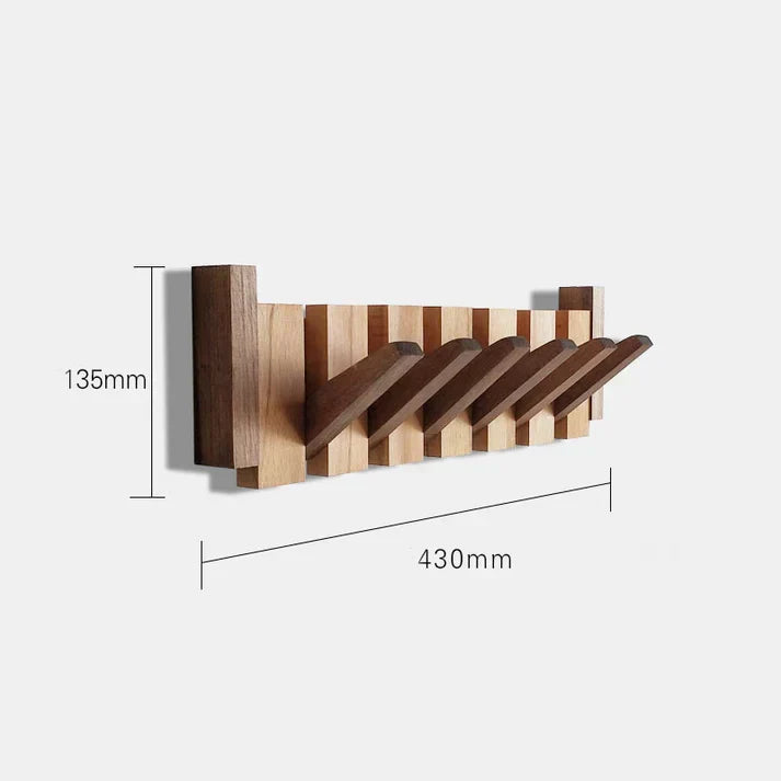 Nahaufnahme eines Walnuss-Wandhakens, zeigt die natürliche Holzmaserung des Kleiderhakens.