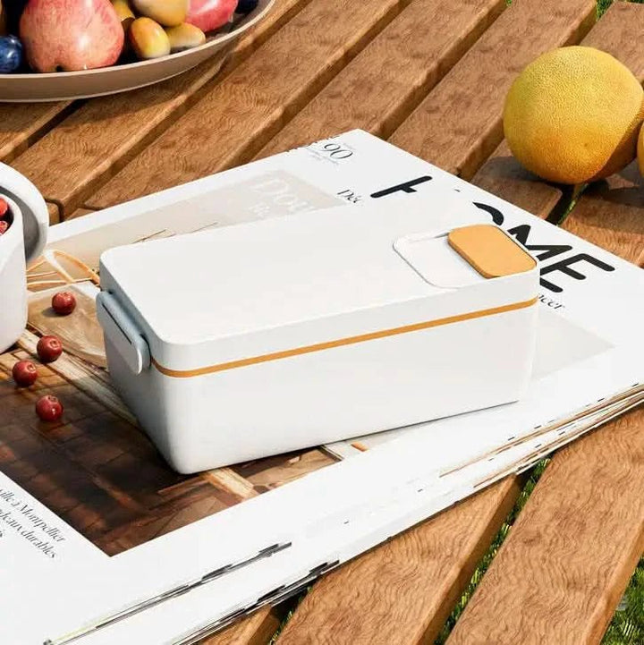 Kompakte elektrische Warmhaltebox, perfekt für warme Mahlzeiten unterwegs; einfach zu bedienen.