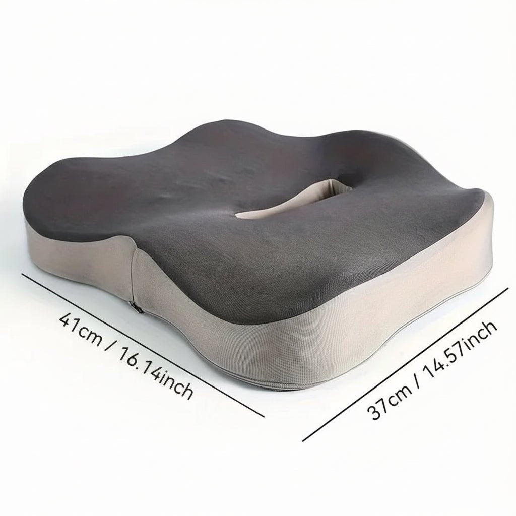 Graues Memory-Schaum-Sitzkissen mit ergonomischer Lendenwirbelstütze, fördert Haltung & reduziert Schmerzen.