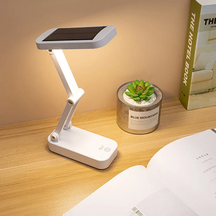 Faltbare Solar LED Tischlampe mit augenschonendem Licht, dimmbar & USB-aufladbar, ideal für Schreibtisch & Leseecken.