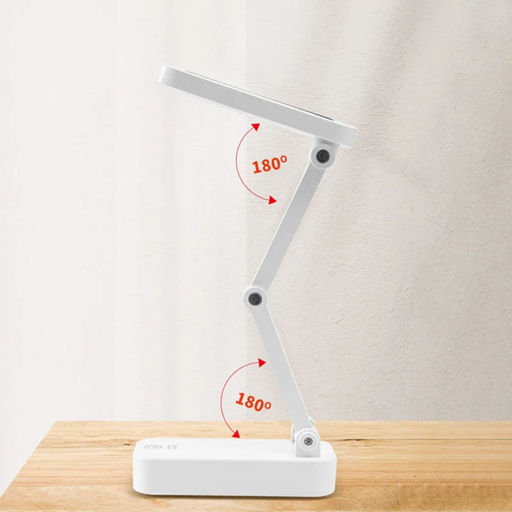 Kompakte, faltbare Solar LED Tischlampe im minimalistischen Design, USB-wiederaufladbar für vielseitige Nutzung.