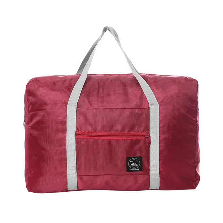 Praktisches Reiseaccessoire: Faltbare Reisetasche aus Nylon. Wasserdicht, leicht & mit großer Öffnung.